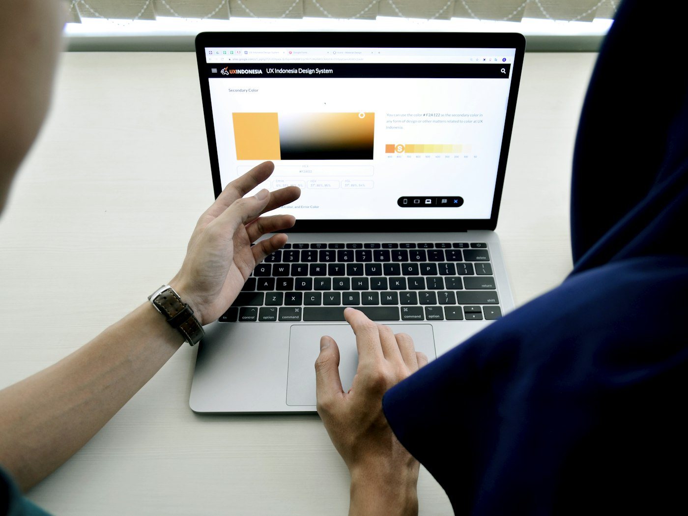 Laptop on a desk displaying a website under review