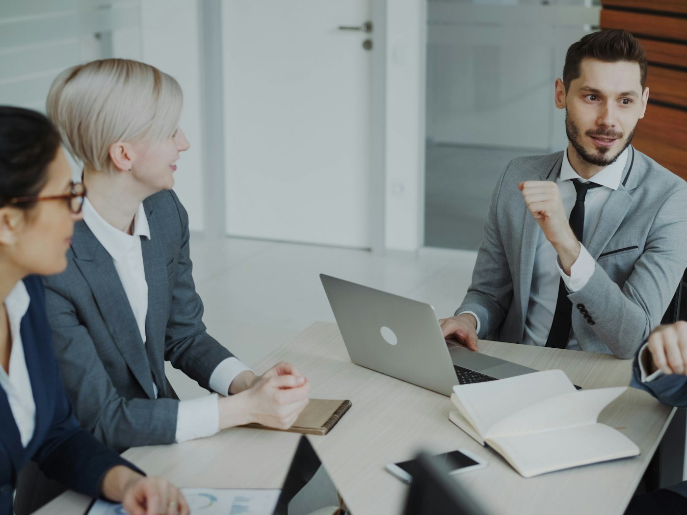 Business professionals meeting around a conference table