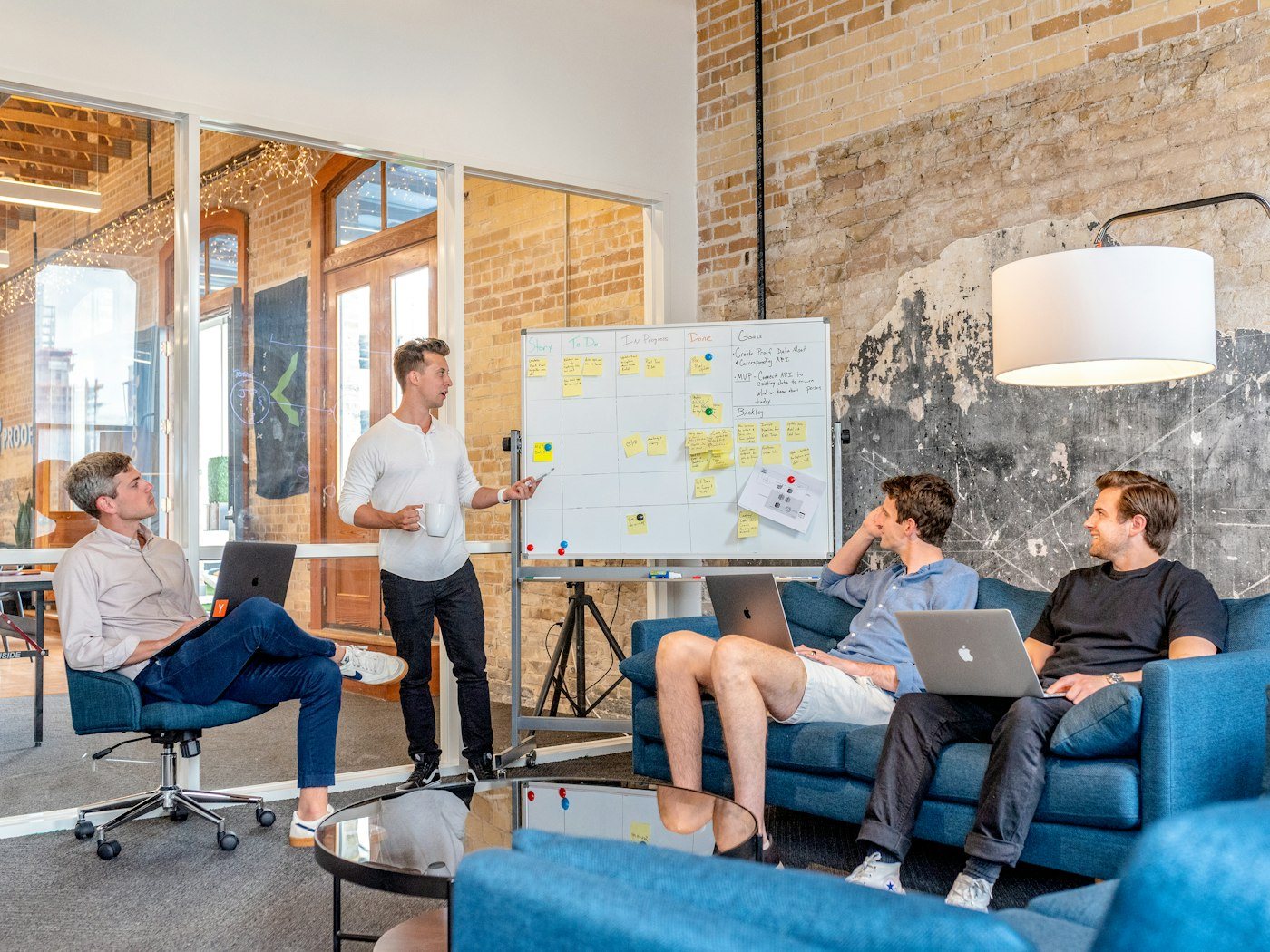 Team planning a marketing experiment at a whiteboard